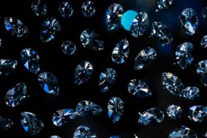 Fluorescence, Polish and Symmetry: Advanced Diamond Quality Factors Explained